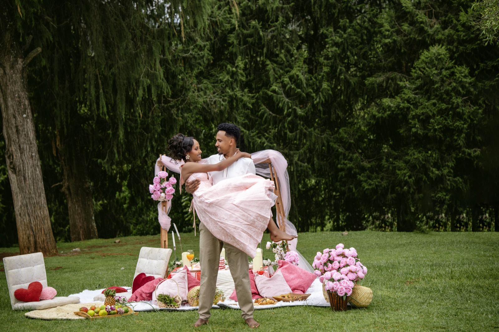 Mikiyas carrying Lidiya in the garden